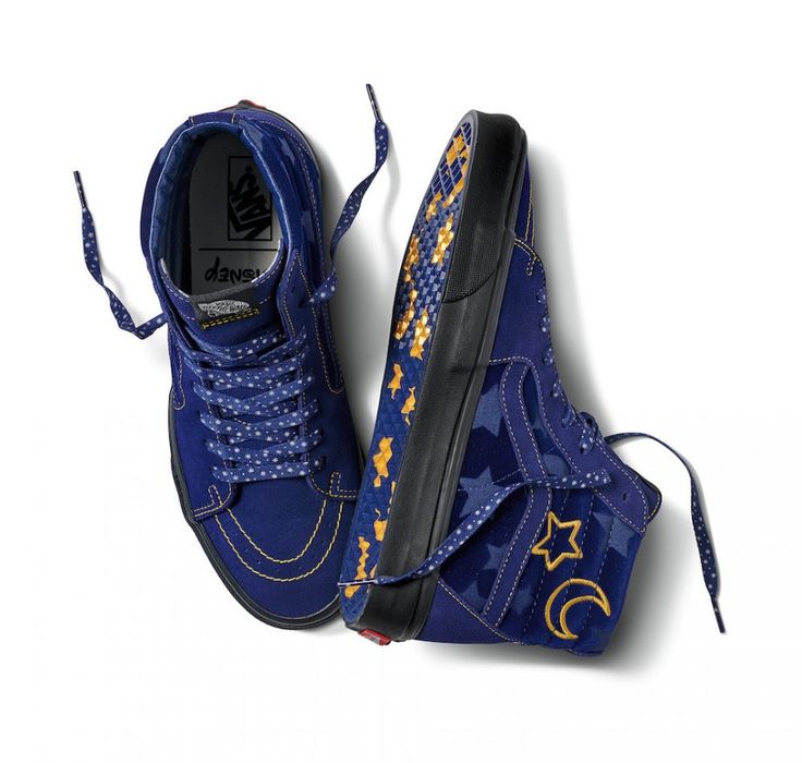 Blue sneakers with star and moon designs on a white background