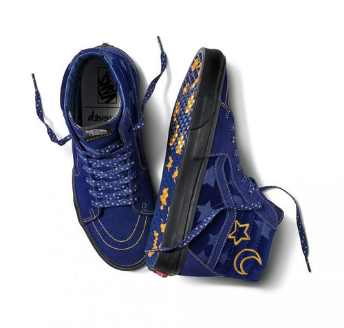 Blue sneakers with star and moon designs on a white background