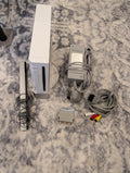 Collection of vintage electronic components and accessories on a textured surface