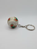 Keychain shaped like a soccer ball with floral patterns on a white background