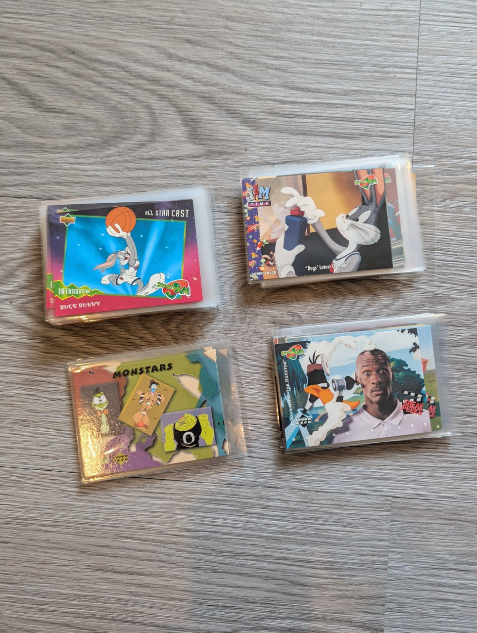 Collection of trading cards on a wooden surface
