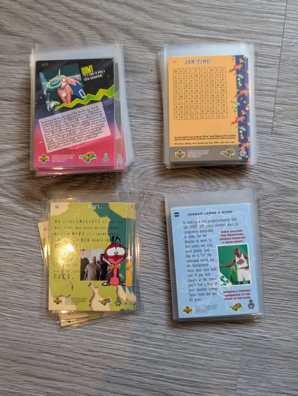 Collection of trading cards on a wooden surface